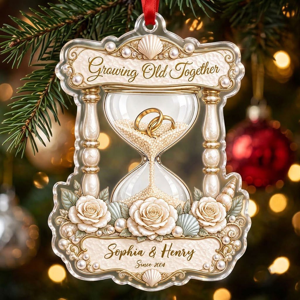 Acrylic hourglass ornament with gold rings, roses, seashells, pearls, and Growing Old Together text.