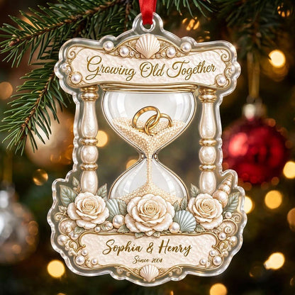 Acrylic hourglass ornament with gold rings, roses, seashells, pearls, and Growing Old Together text.