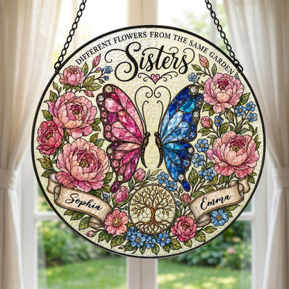 Round suncatcher with pink and blue butterfly, peony wreath, Tree of Life, and Sisters text with two name ribbons.