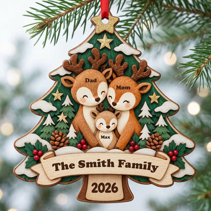 Tree-shaped wood ornament with a deer family, star topper, holly, pinecones, and personalized names and year.