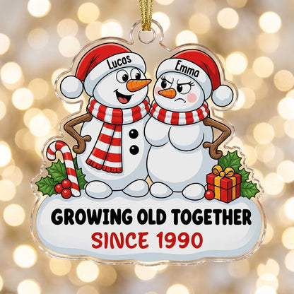 Custom-cut acrylic ornament of a snowman couple with candy cane, gift box, and Growing Old Together text on a snowy base