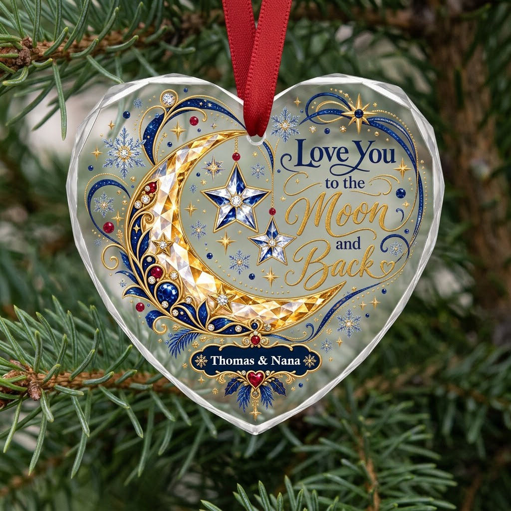 Heart glass ornament with jeweled gold crescent moon, blue hanging stars, and 'Love You to the Moon and Back' text.