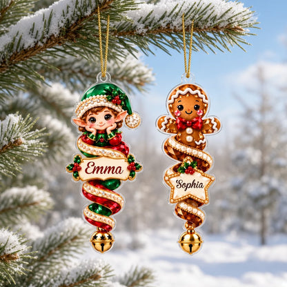 Acrylic angel and gingerbread ornaments with jeweled ribbons, heart or star name banners, and gold bells.