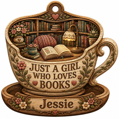 Teacup-shaped wood ornament with cozy library scene and 'JUST A GIRL WHO LOVES BOOKS' plus a personalized name.