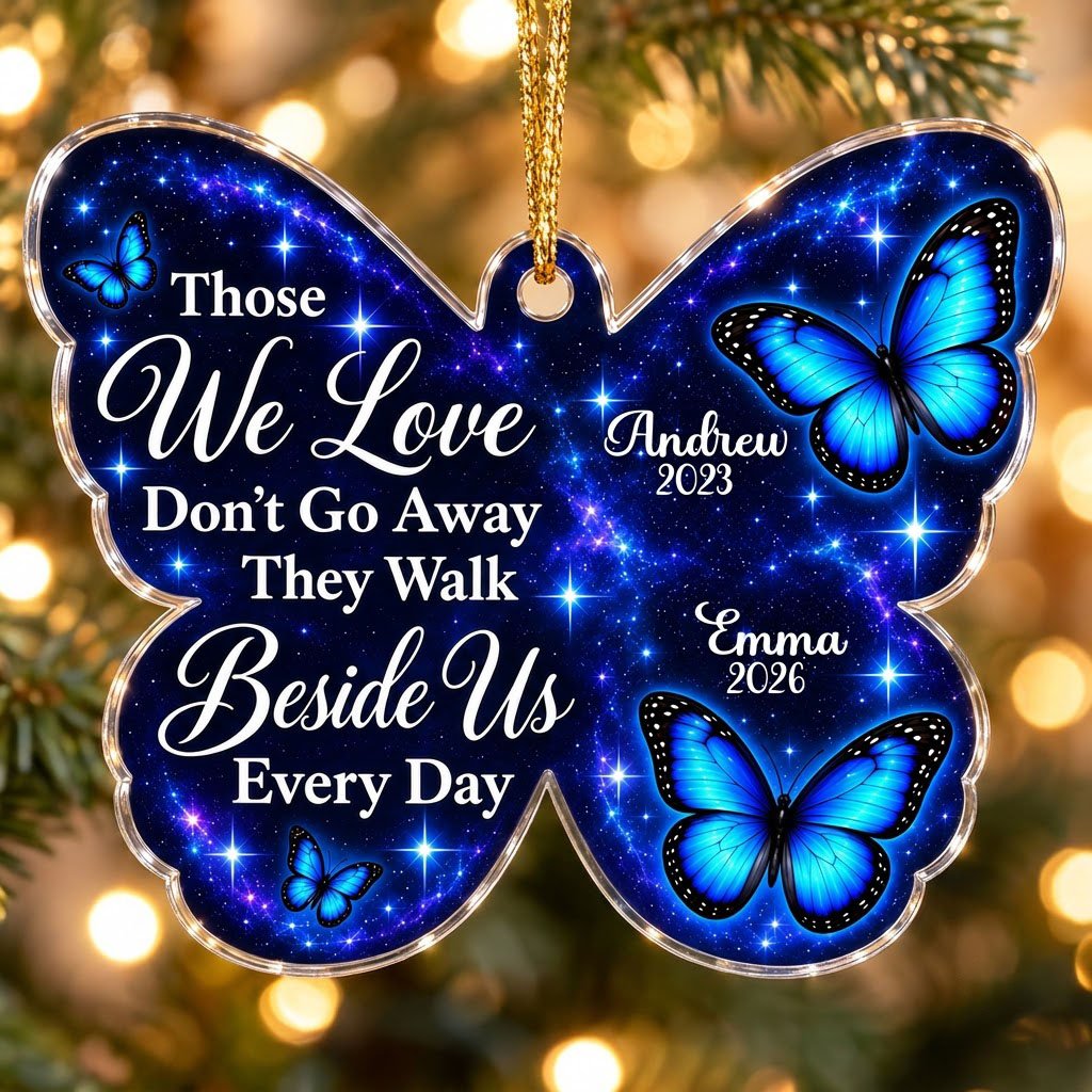 Butterfly-shaped ornament with blue butterflies and a galaxy background, reading Those We Love Don't Go Away.