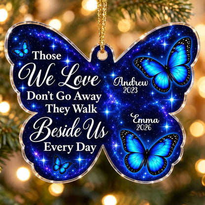 Butterfly-shaped ornament with blue butterflies and a galaxy background, reading Those We Love Don't Go Away.
