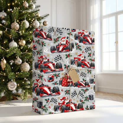 Light grey wrapping paper with Santa in red F1 cars, checkered flags, helmets, holly, and snowflakes.