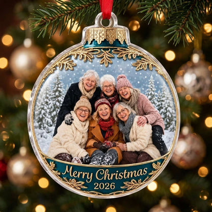 Clear acrylic bauble ornament with photo of six women in snowy pines, gold filigree, teal banner and Merry Christmas tex