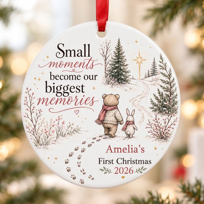 Round ceramic ornament with bear and bunny in scarves on snowy path, trees, star, quote, and personalized name and year.
