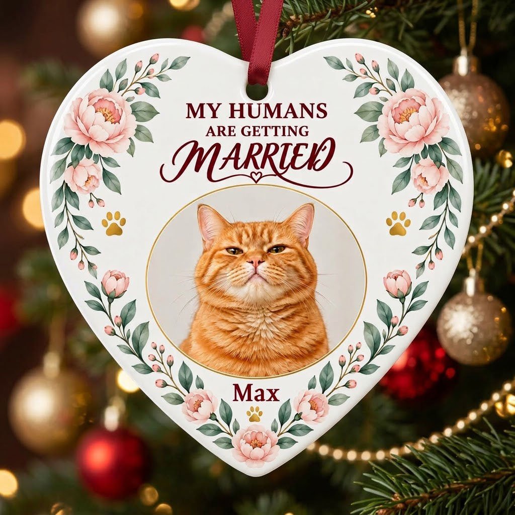 Heart ceramic ornament with 'My Humans Are Getting Married,' a cat photo, pink florals, gold paw prints, and a heart ico