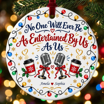 Round ceramic ornament with lights border, two microphones with red bows, and two coffee cups with heart steam.