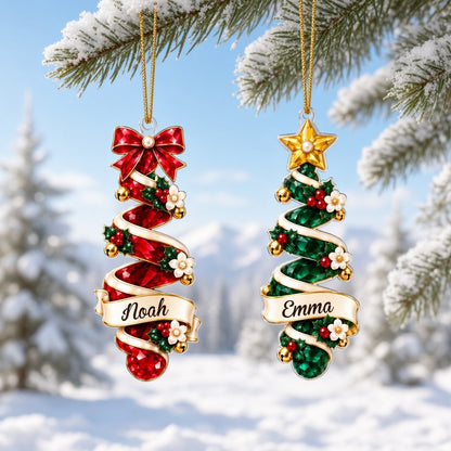 Acrylic ornament shaped around two green gem-style Christmas trees with holly, berries and names Oliver and Emma.