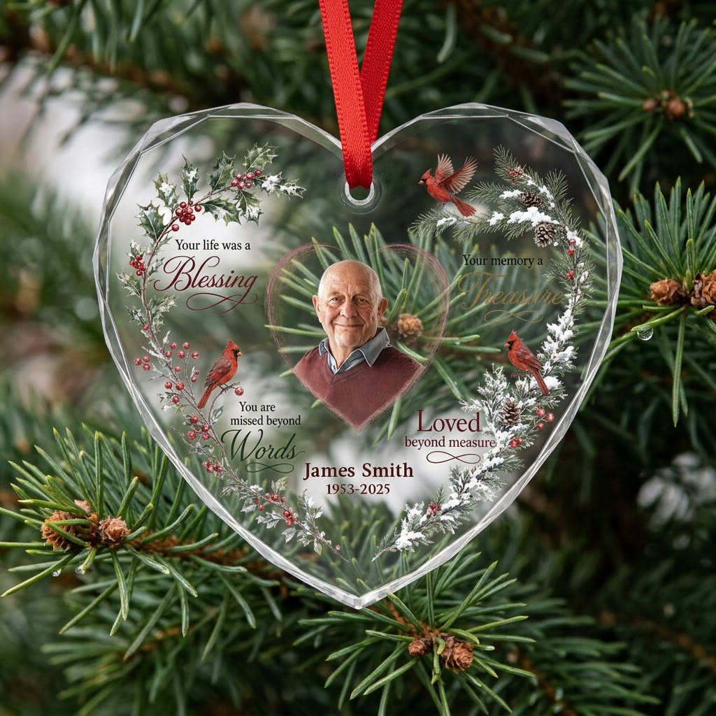 Heart glass ornament with a photo, red cardinals, and a winter wreath of pine, holly, berries, and pinecones.