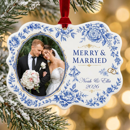 Scalloped ceramic ornament with blue floral border, 'MERRY & MARRIED', gold rings and bells, and a couple photo frame.