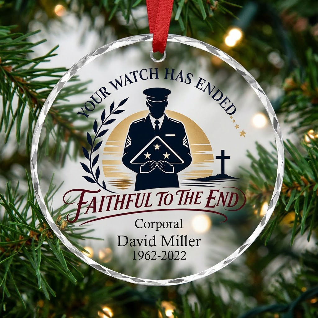Round glass ornament with officer silhouette holding a folded flag, golden sunset, cross, and the words YOUR WATCH HAS E