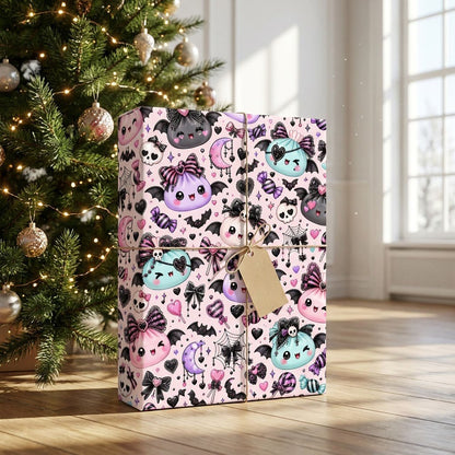 Pastel goth Halloween wrapping paper with cute bat-winged characters, skulls, moons, bows and candies.
