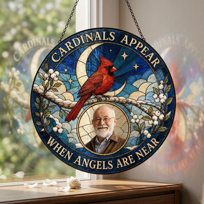 Round stained-glass style suncatcher with a red cardinal, starry blue sky, crescent moon, and a circular frame with a pe