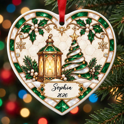 Heart ornament with emerald stained-glass border, gold lantern, spiral tree, holly, and a name-and-year scroll plaque.