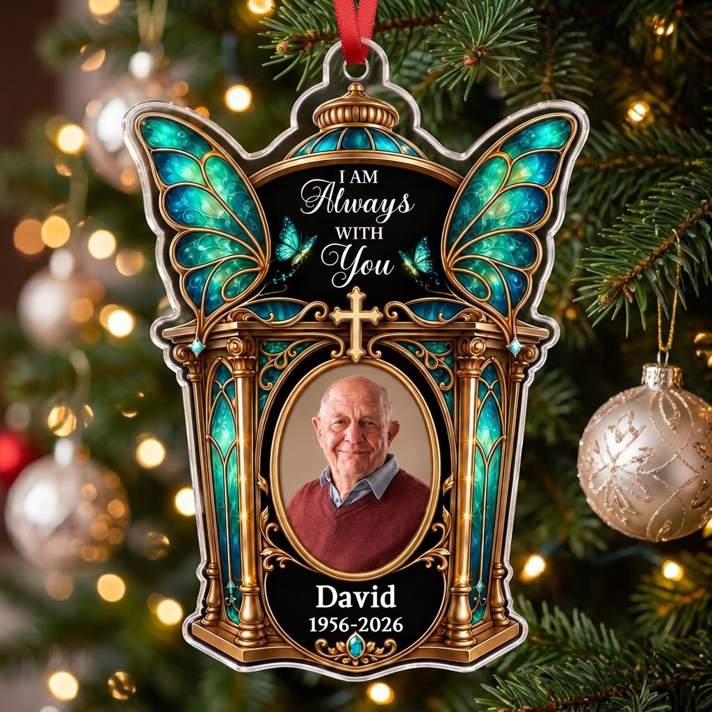 Clear acrylic ornament with winged shrine, teal butterfly wings, cross, oval photo, and 'I AM Always WITH You'.