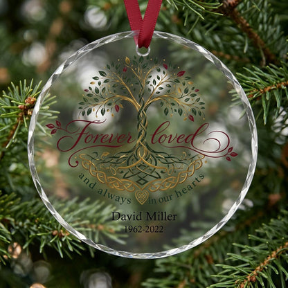 Round glass ornament with Celtic Tree of Life in green, gold and red, reading Forever loved and always in our hearts.