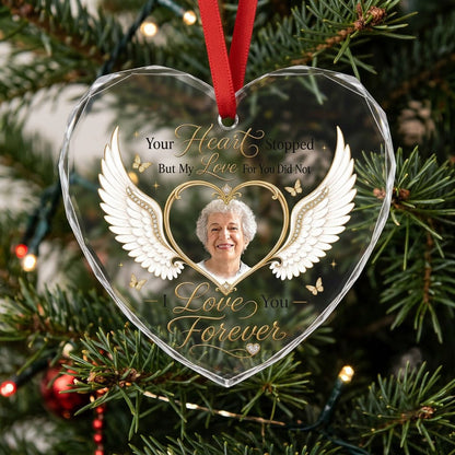 Heart-shaped glass ornament with white angel wings, gold heart photo frame, golden butterflies and sparkles.
