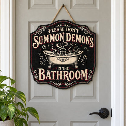 Ornate plaque with tub, bat-winged black cat, bubbles, stars, and 'Please Don't Summon Demons in the Bathroom'.