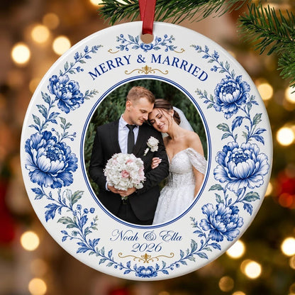 Round ceramic ornament with blue chinoiserie border, gold accents, and a circular wedding photo framed at center.