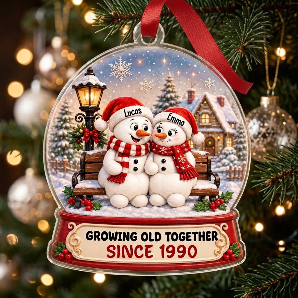 Acrylic snowglobe ornament with two snowmen on a bench, Santa hats, and Growing Old Together text.