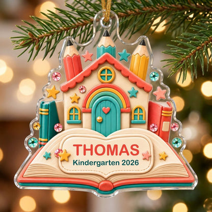 Clay-style schoolhouse on an open book with pencils and stars, personalized with child's name and Kindergarten 2026