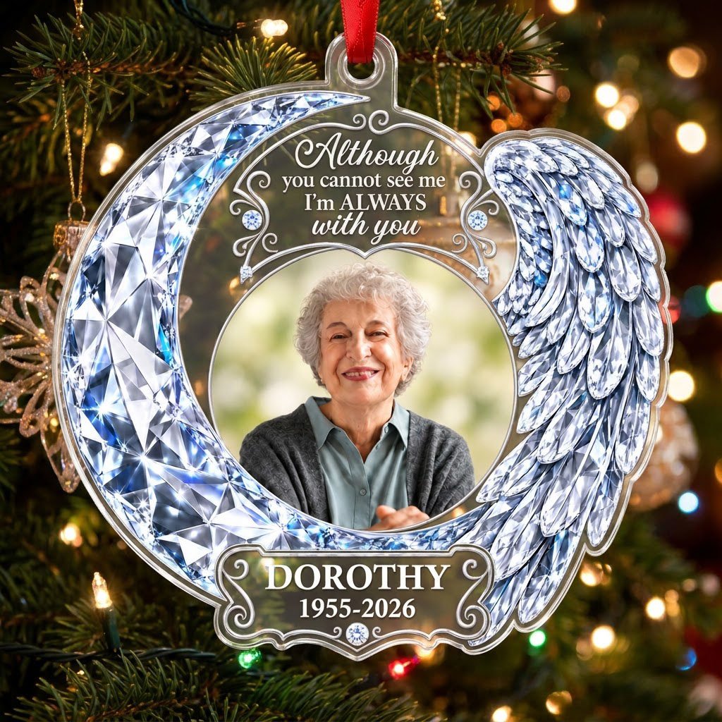 Acrylic ornament with blue crystal-look crescent moon, angel wing, circular photo frame and memorial quote.