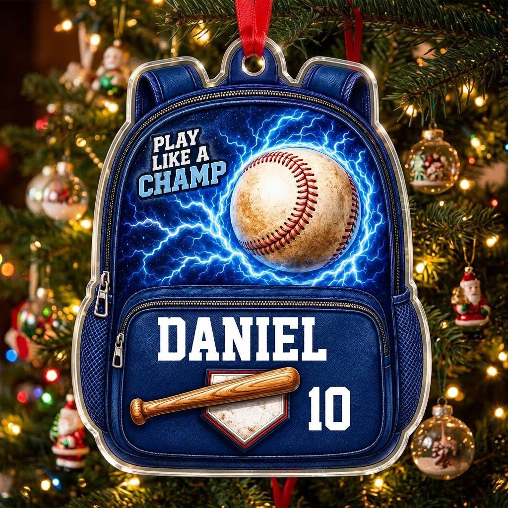 Backpack-shaped acrylic ornament with a baseball, blue lightning, a bat on home plate, and PLAY LIKE A CHAMP text.
