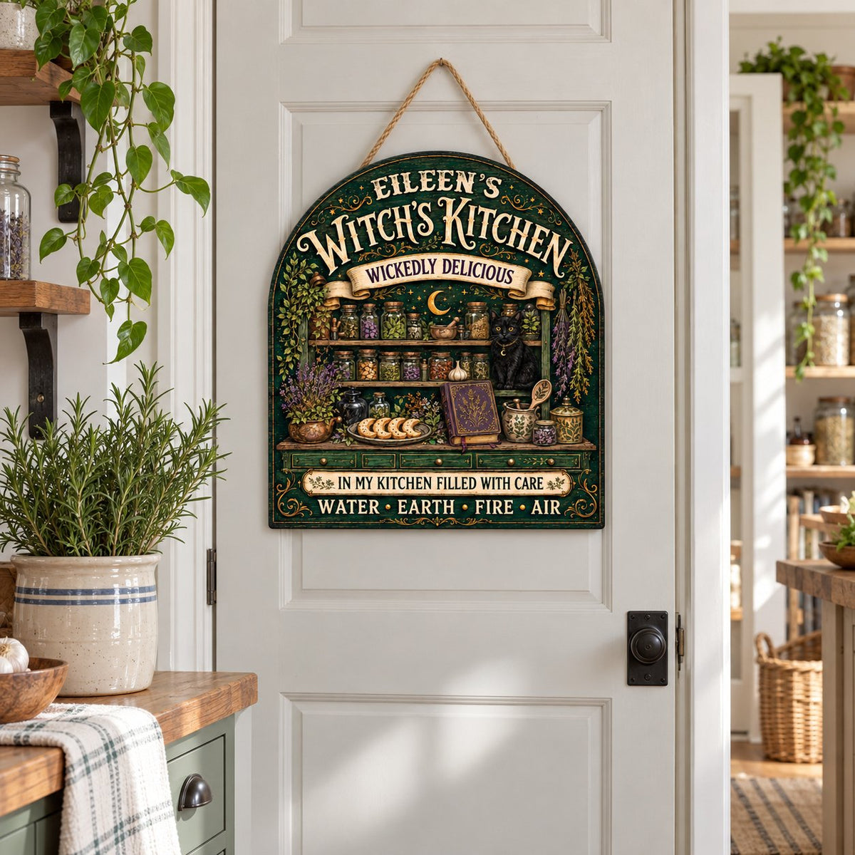 Arch wooden sign with black cat, apothecary jars, lavender, crescent moon and stars, and the text WITCH'S KITCHEN.