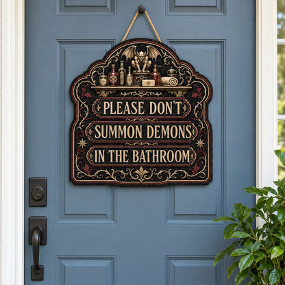 Ornate arched wooden sign with a gargoyle shelf and the message Please Don't Summon Demons in the Bathroom.