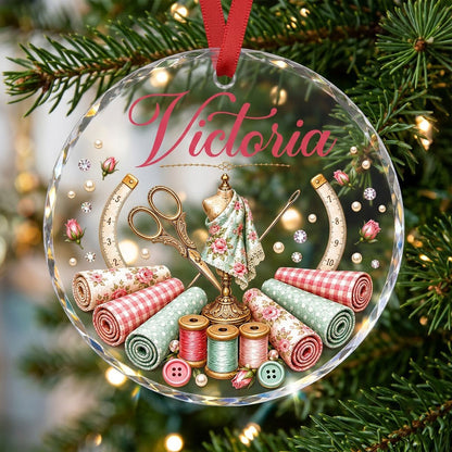 Round faceted glass ornament with a vintage dress form, sewing notions, and personalized name Victoria in pink and gold 