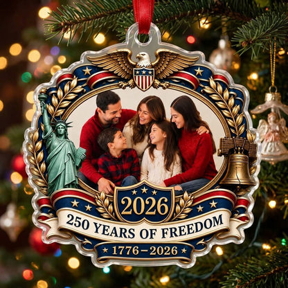 Ornate scalloped acrylic ornament with eagle, Statue of Liberty, Liberty Bell and an oval family photo frame.