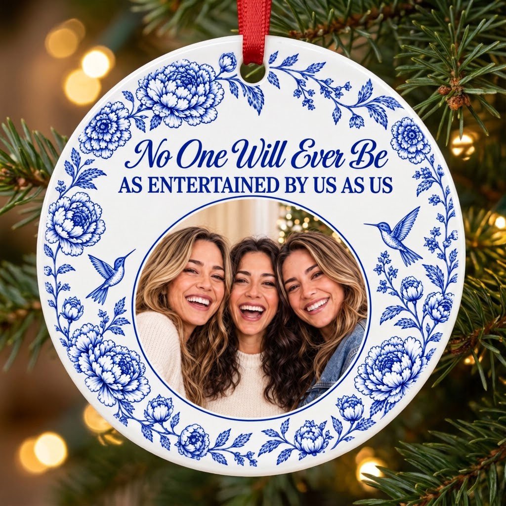 Round white ceramic ornament with blue floral border, two hummingbirds and a central circular photo frame with friends.