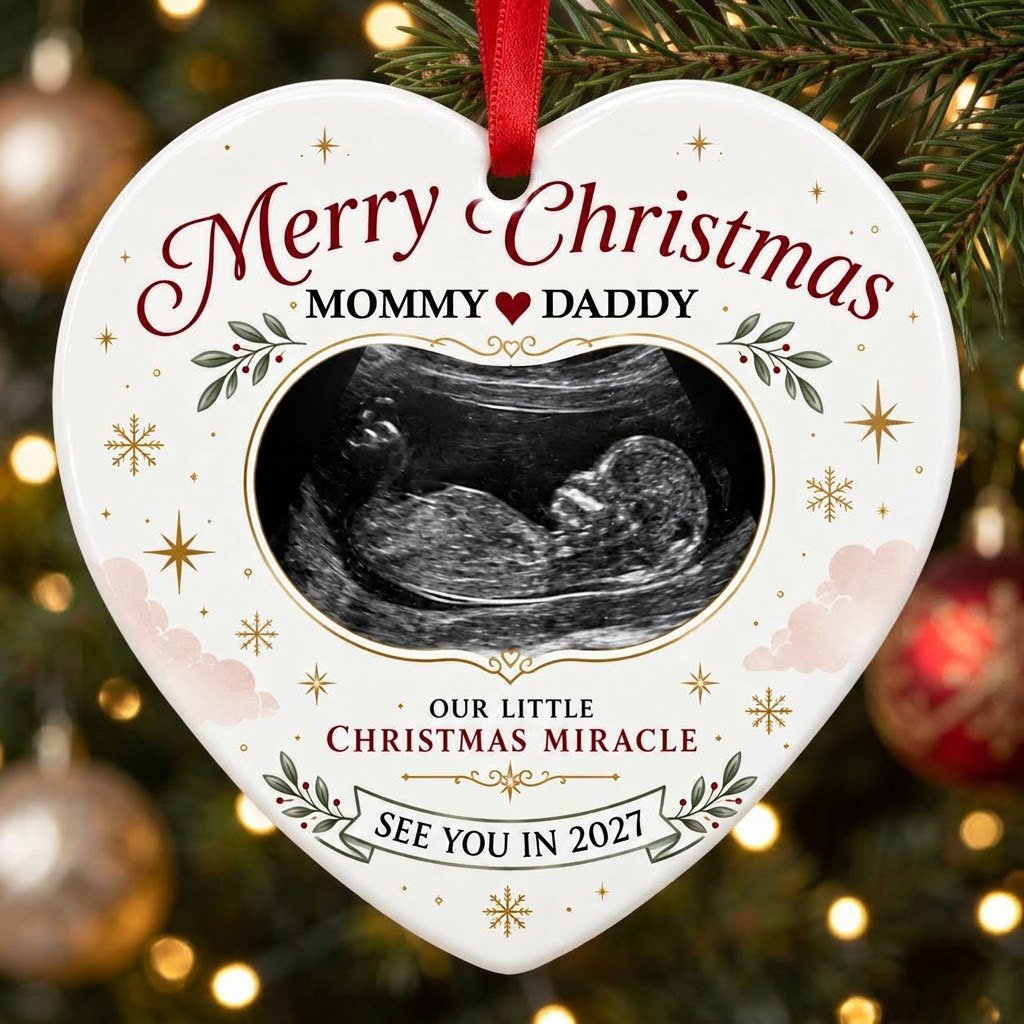 Heart ceramic ornament with ultrasound photo, gold starbursts, green leaves with red berries, and a bottom banner.