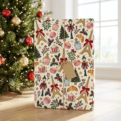 Cream paper with gold Eiffel Towers, Christmas trees, street lamps, macarons, croissants, holly and stars pattern.