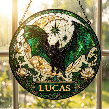 Round stained-glass style suncatcher with black bat, green wings, crescent moon, ivy, white flowers, and a personalized 