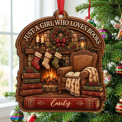 Wood ornament with fireplace, wreath, stockings, armchair and books, plus 'Just a Girl Who Loves Books' and a name.