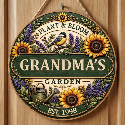 Round wooden sign with sunflowers, lavender, a chickadee, and green banners reading PLANT & BLOOM and GARDEN.