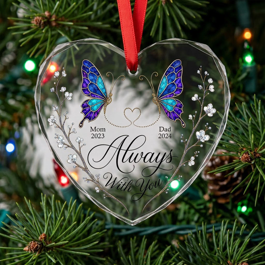 Heart-shaped glass ornament with stained-glass butterflies, gold dotted heart, and white-flower vines.