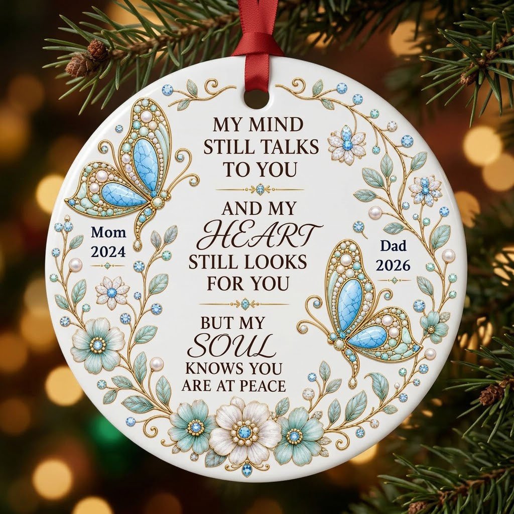 White round ornament with jeweled butterflies, floral wreath, and memorial quote with personalized name and year.