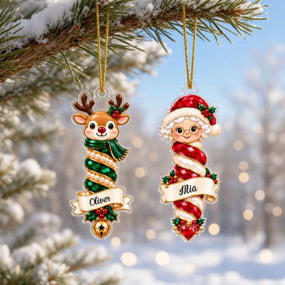 Custom-cut clear acrylic ornaments: a Christmas tree finial and a Mrs. Claus finial with cream name banners.