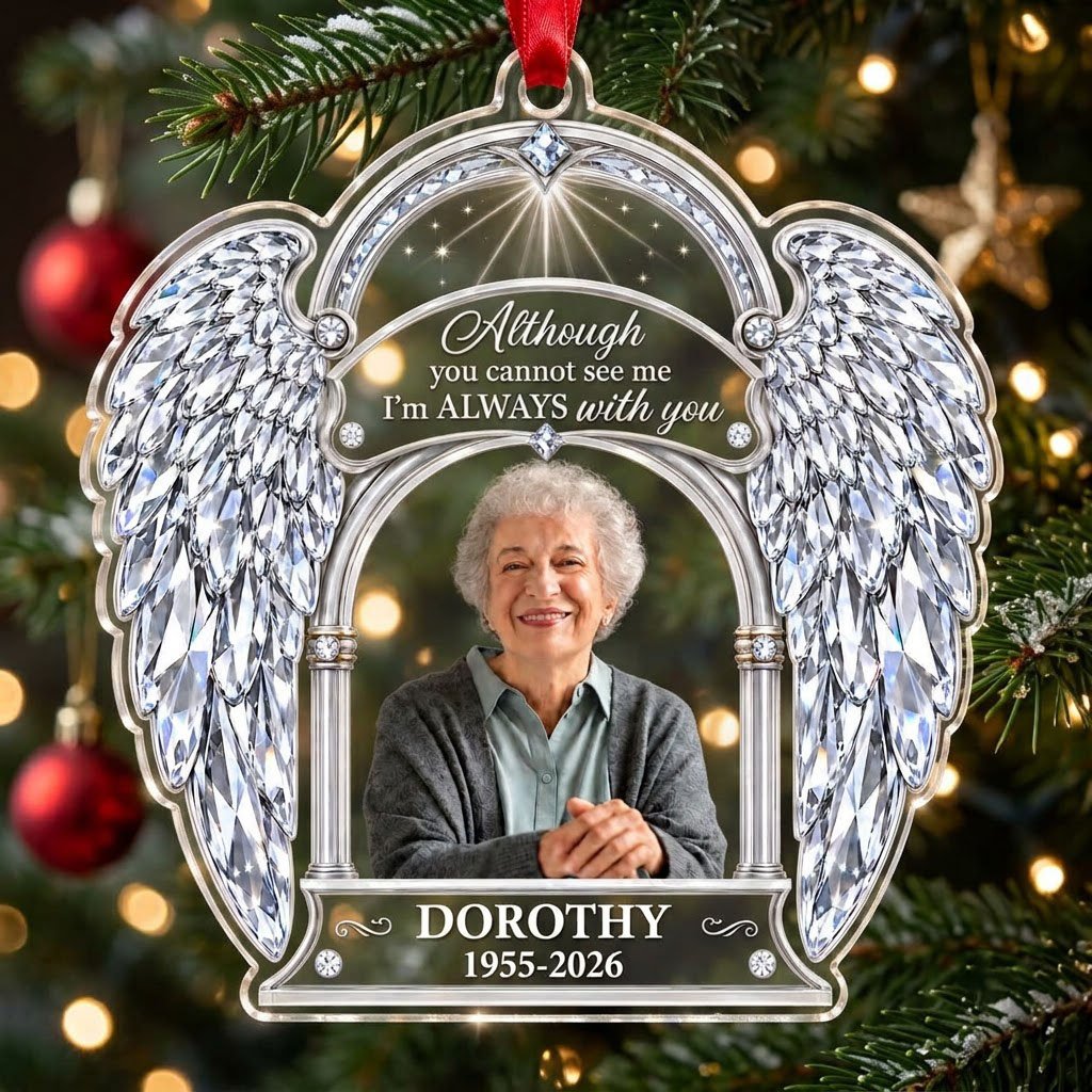 Acrylic memorial ornament with crystal angel wings, arched photo frame and wood-grain name and date banners.