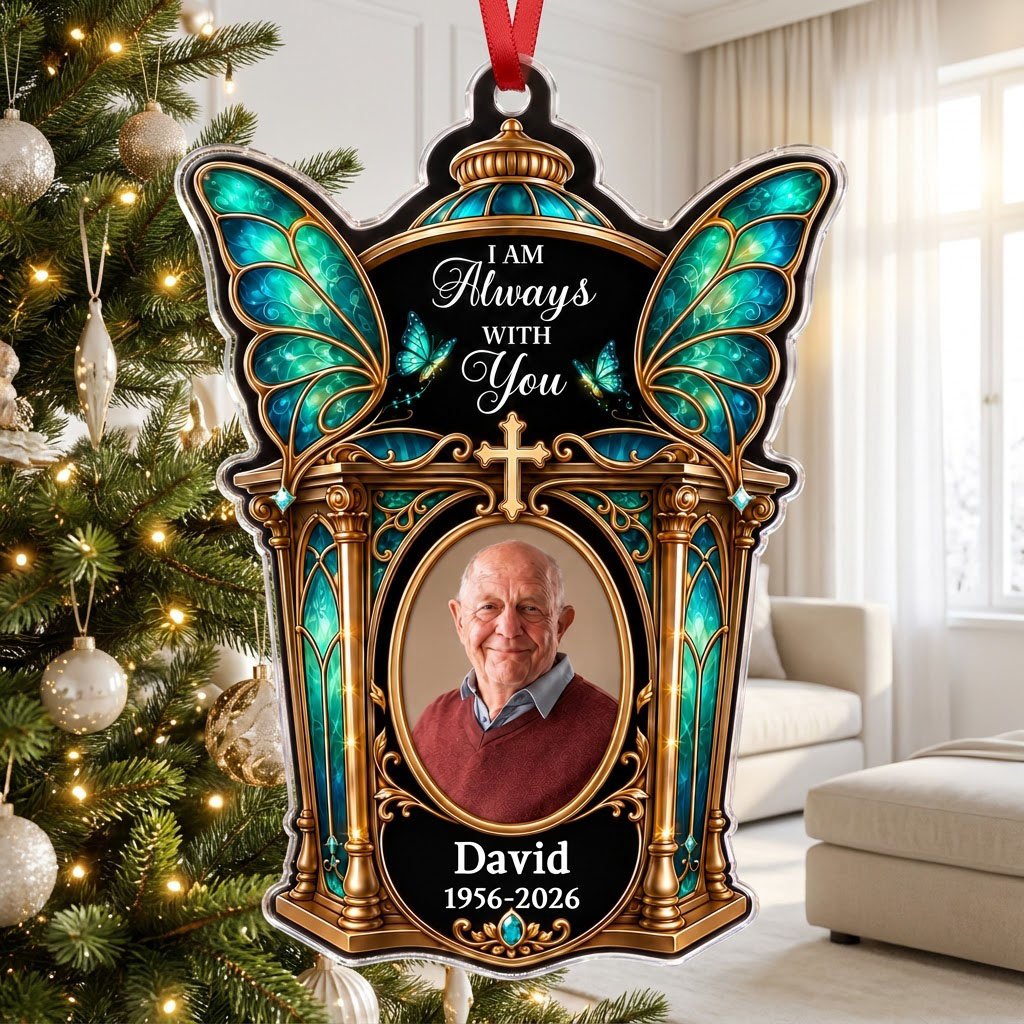 Clear acrylic ornament with winged shrine, teal butterfly wings, cross, oval photo, and 'I AM Always WITH You'.