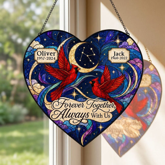 Heart stained glass suncatcher with two red cardinals, crescent moon, stars, clouds, and memorial name banners.