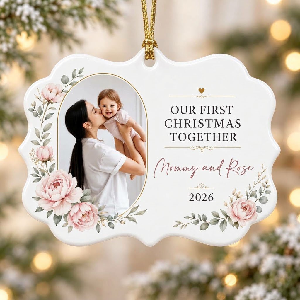 White scalloped ceramic ornament with gold oval photo frame, pink peonies, and Our First Christmas Together text.