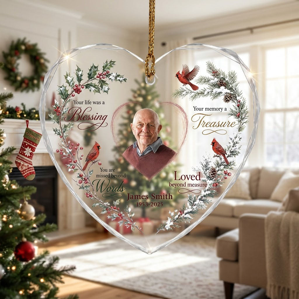 Heart glass ornament with a photo, red cardinals, and a winter wreath of pine, holly, berries, and pinecones.