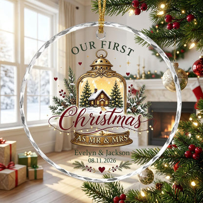 Round glass ornament with gold lantern, cozy cabin, pine branches, holly berries, and Our First Christmas as Mr & Mrs.
